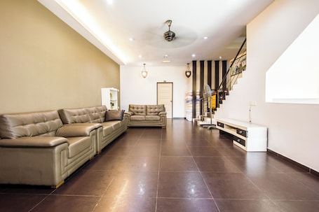Living area. Value Inn Homestay by uBook
