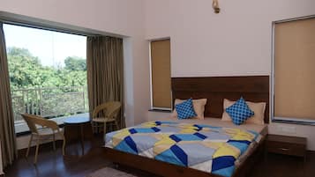 Deluxe Room, 1 King Bed, Garden View | Desk, laptop workspace, free WiFi