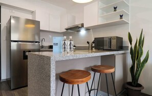 Fridge, microwave, stovetop, coffee/tea maker