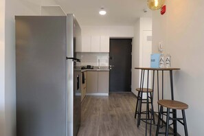 Fridge, microwave, stovetop, coffee/tea maker