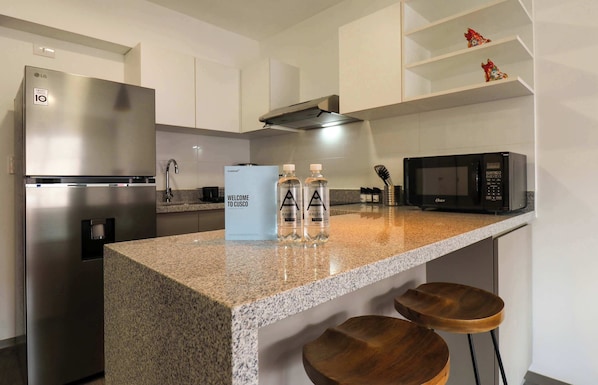 Fridge, microwave, stovetop, coffee/tea maker