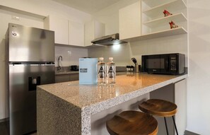 Fridge, microwave, stovetop, coffee/tea maker