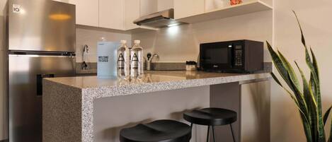 Fridge, microwave, stovetop, coffee/tea maker