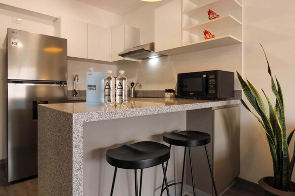 Fridge, microwave, stovetop, coffee/tea maker