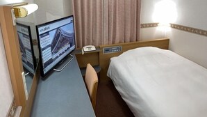 A hotel room with a bed, a desk with a computer, a telephone, and a window with curtains. - Hotel Alpha-One Izumo (Izumo)