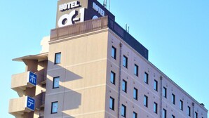 A hotel building with a sign reading "HOTEL" and a large "H" logo. - Hotel Alpha-One Izumo (Izumo)