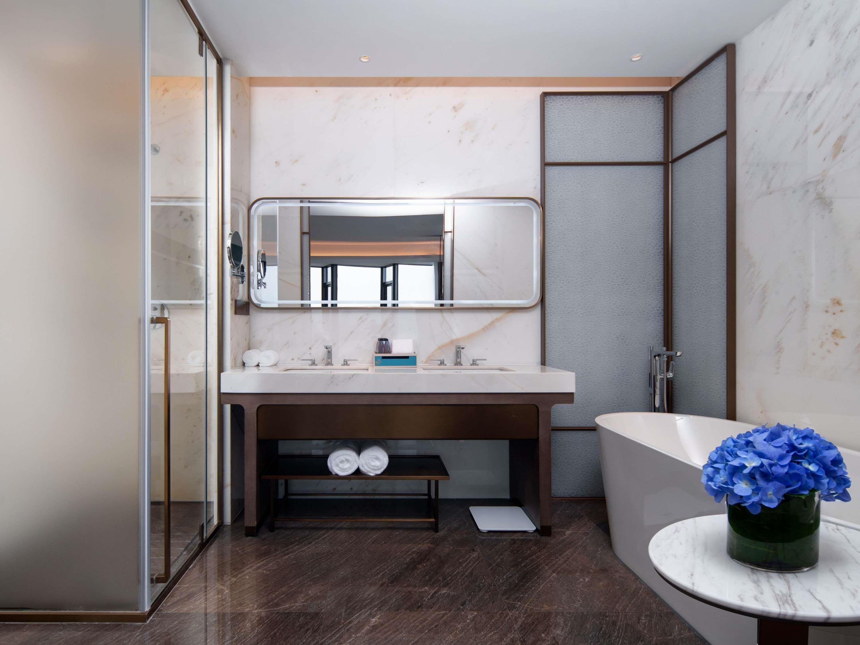 Premium bedding, down comforters, minibar, in-room safe