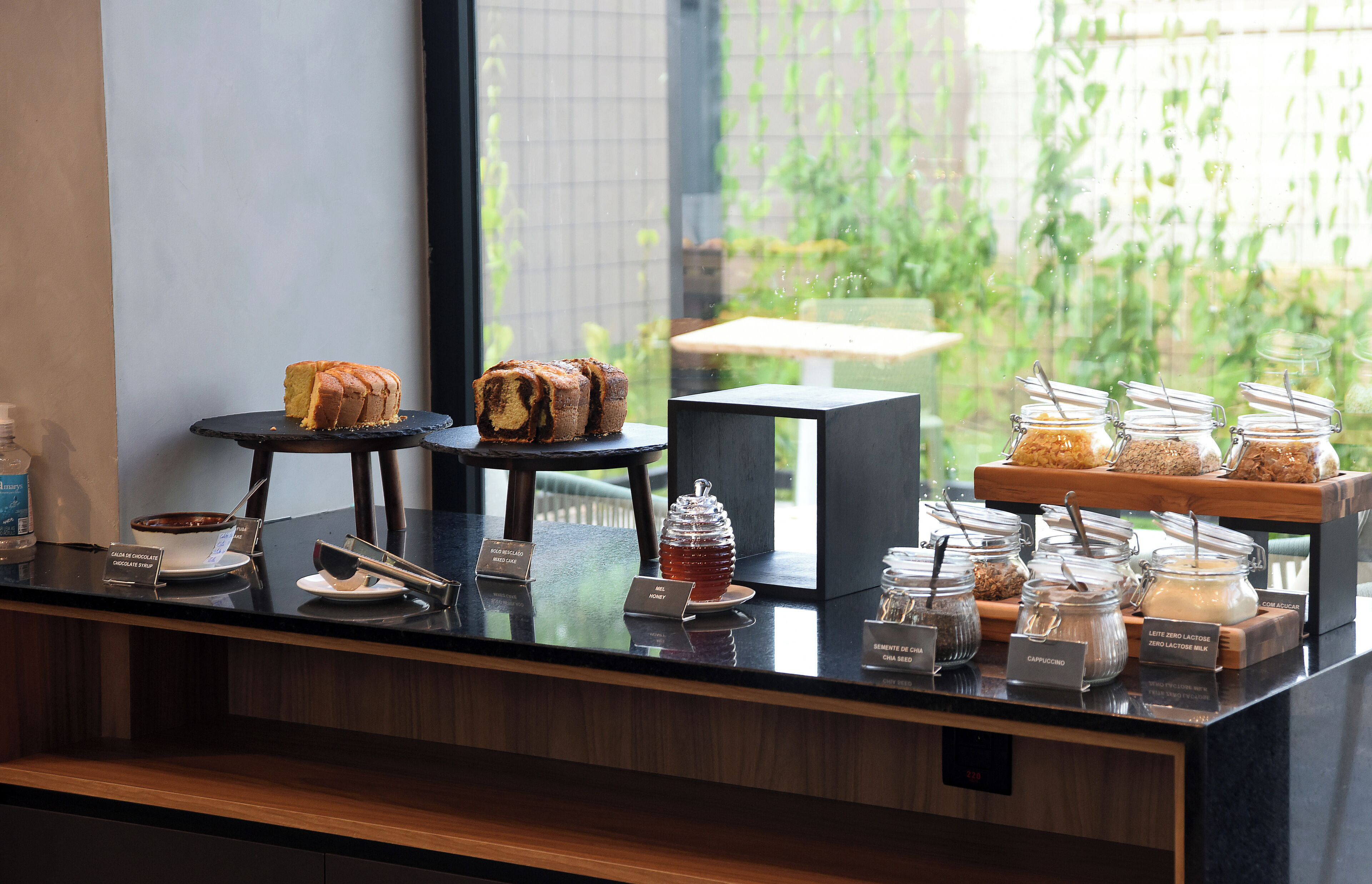 A breakfast buffet with various food items and drink options.