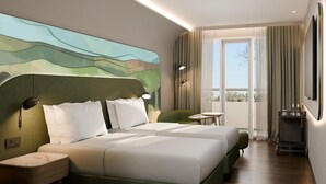 A hotel room with a large bed, two bedside tables, a green armchair, a small round table, and a view of the outdoors through a large window. - Mercure Garut City Center (Garut)
