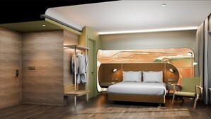 A modern hotel room with a large bed, a seating area, and a built-in wardrobe. - Mercure Garut City Center (Garut)