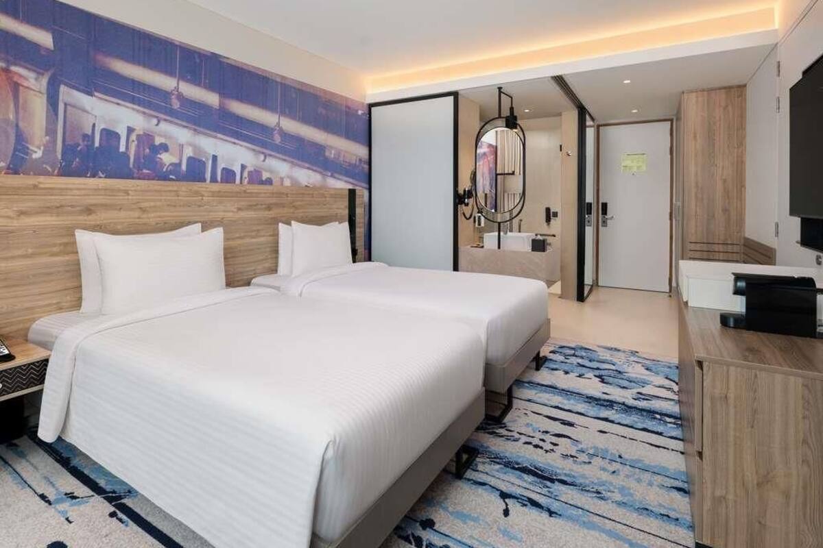 Habitación ejecutiva con 2 camas individuales | Minibar, espacio para trabajar con un portátil, cortinas opacas