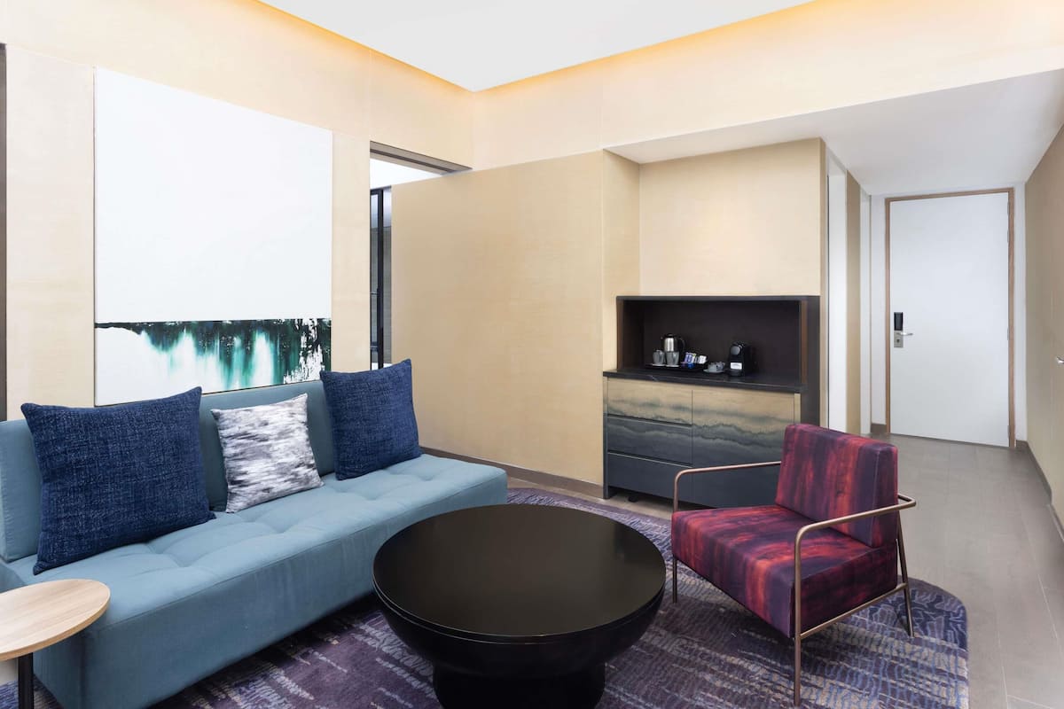 Junior Suite with King bed, city view, 15% F&B discount, 4 pieces laundry | 1 bedroom, minibar, laptop workspace, blackout drapes