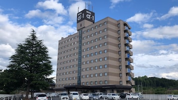 A multi-story hotel with a prominent sign indicating it is a hotel.