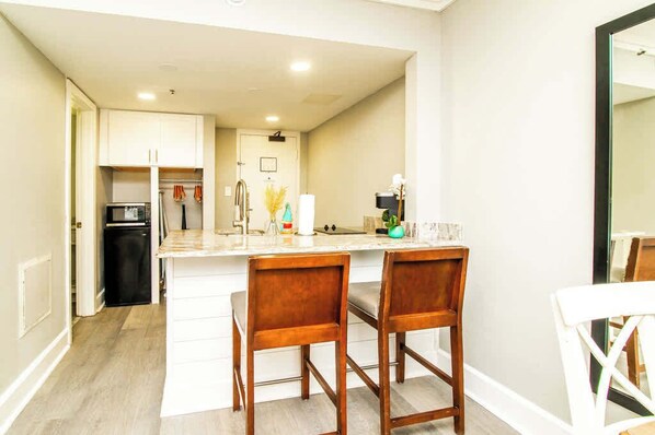 Fridge, microwave, stovetop, coffee/tea maker