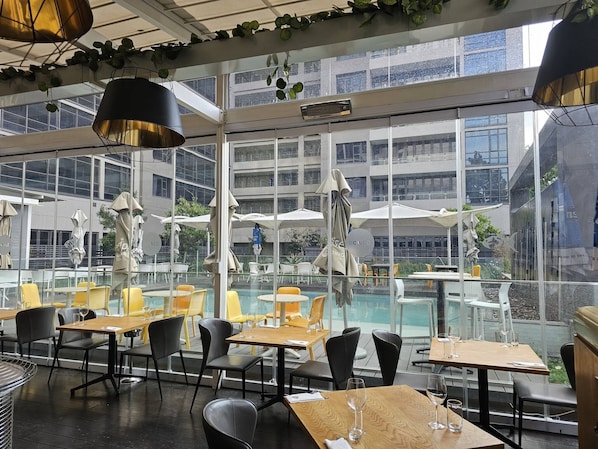 Dine with a view of the pool and surrounding landscape.