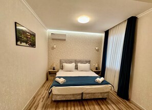 Basic Double Room, City View | In-room safe, desk, laptop workspace - Huaxia Hotel (Tashkent)
