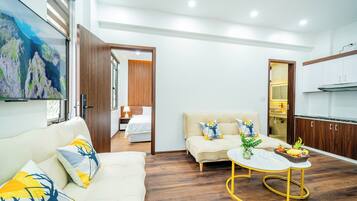 Family Apartment, 1 King Bed, Balcony, City View | Living area | Smart TV