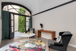Deluxe Apartment | Living area | 50-inch TV with cable channels - Palazzo Pazzi Vitali By Geco Vacation Rentals (Florence)