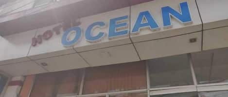 A hotel sign with the name 'OCEAN' prominently displayed.