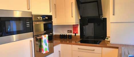 Coffee/tea maker, fridge, microwave, oven