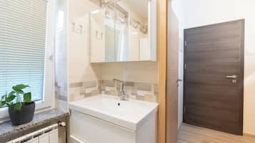 Shower, towels, soap, toilet paper