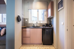 Habitación superior | Cocina privada | Frigorífico pequeño y microondas