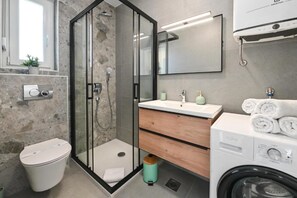 Shower, hair dryer, towels, soap