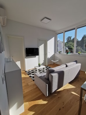 Comfort Apartment, 2 Bedrooms, City View | Living area | Flat-screen TV - Apartments Egis Koper (Koper)