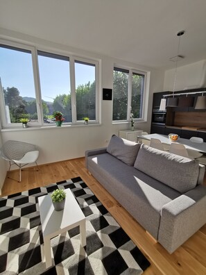 Comfort Apartment, 2 Bedrooms, City View | Living area | Flat-screen TV - Apartments Egis Koper (Koper)