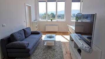 Comfort Apartment, 3 Bedrooms, City View | Living area | Flat-screen TV