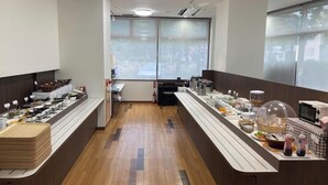 A breakfast buffet setup with various food items and a coffee station. - Hotel Alpha-One Yamaguchi Inter (Yamaguchi)