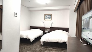 A hotel room with two single beds, a small bedside table with a phone, a framed picture on the wall, and a large window with curtains. - Hotel Alpha-One Yatsushiro (Yatsushiro)