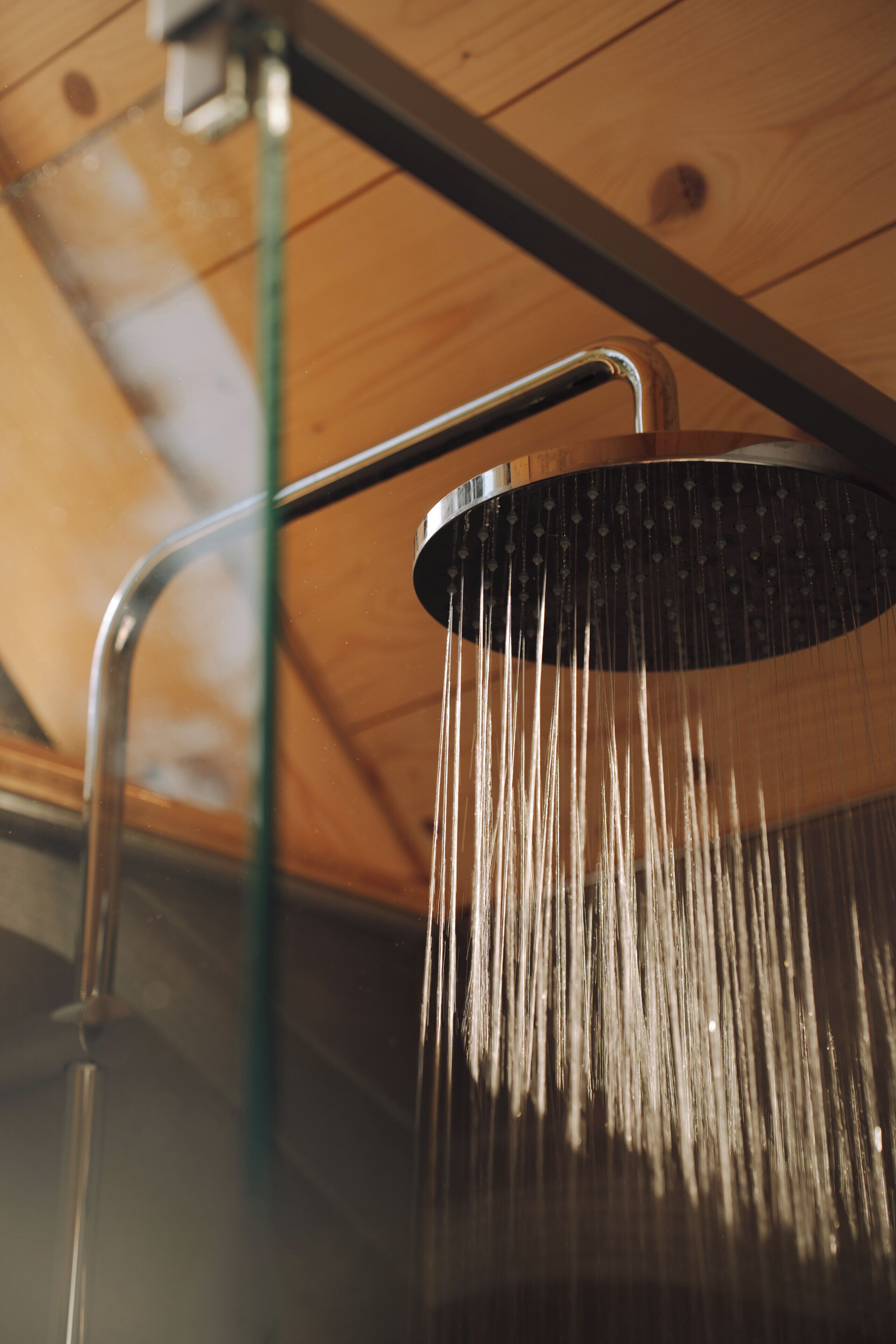A showerhead with water flowing down.