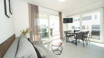 Comfort Apartment, 2 Bedrooms | Living area | 32-inch TV with satellite channels