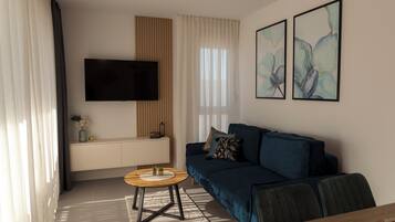 Comfort Apartment, 2 Bedrooms | Living area | 32-inch TV with satellite channels