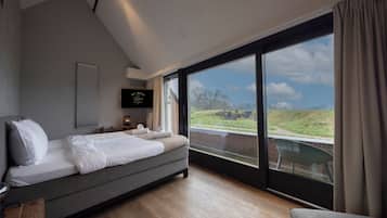 Habitación doble Deluxe | Cunas, wifi gratis y ropa de cama