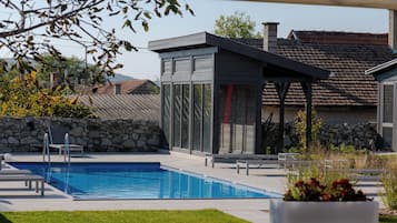 Outdoor pool, pool umbrellas, pool loungers