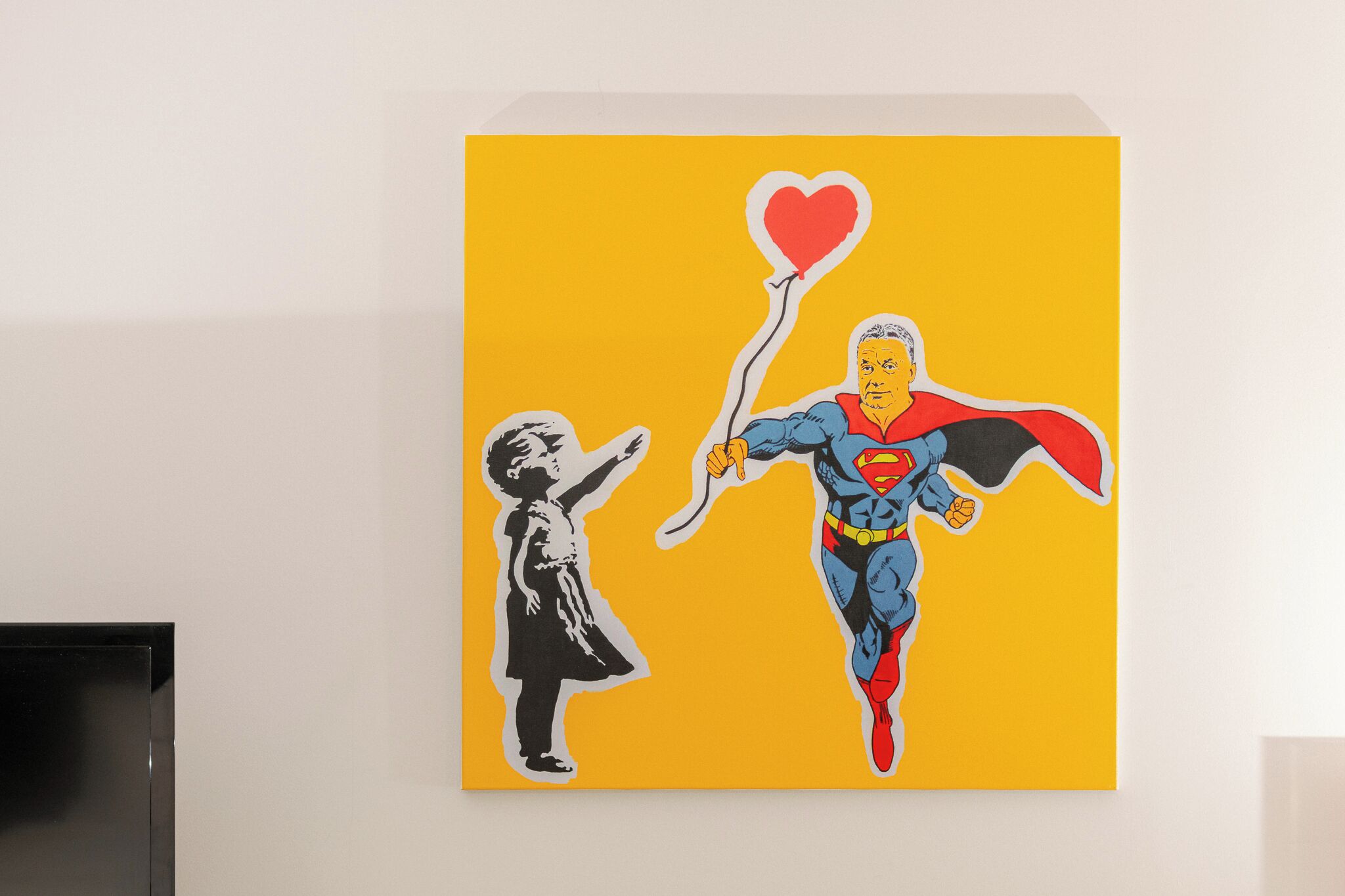 A painting of a superhero holding a heart-shaped balloon, with a child reaching out.