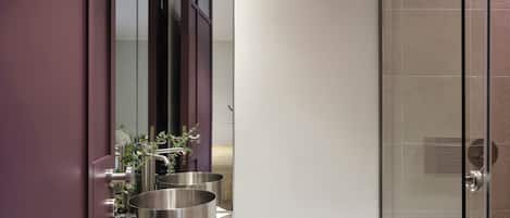 Deluxe Suite Semi-Basement | Bathroom | Shower, towels, soap, shampoo