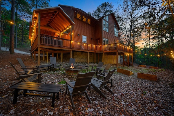 Firepit has seating for 18 and forest views. BYO firewood