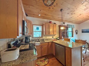 Fridge, microwave, oven, stovetop - Tuckasegee Cabin One bedroom rental on the Tuckasegee River (Whittier)