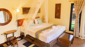 A room with a bed, a bedside table, a lamp, and a window with curtains. - Palette Luxe Elephant Camp Maerim (Mae Rim)