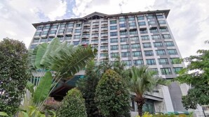 A multi-story hotel with a modern design, featuring balconies and large windows. - Sabah Oriental Hotel Kota Kinabalu (Kota Kinabalu)