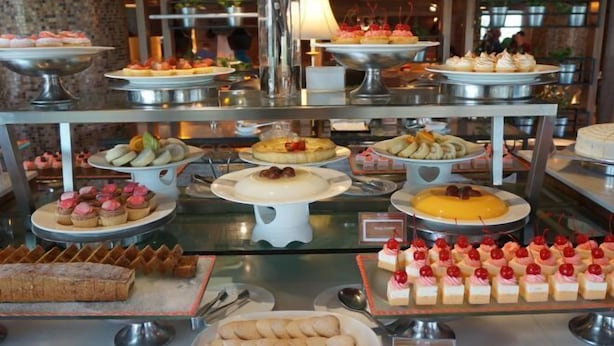 A buffet with various desserts and pastries displayed on multiple serving platters. - Sabah Oriental Hotel Kota Kinabalu (Kota Kinabalu)