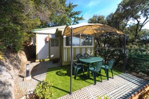 A small, single-story building with a covered patio area.