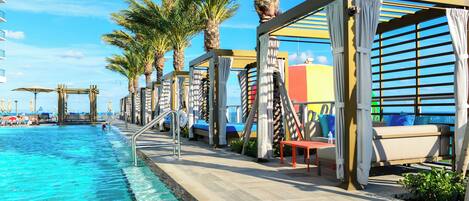 Outdoor pool, free cabanas, pool umbrellas