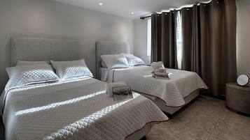 Standard Quadruple Room, City View | Soundproofing, iron/ironing board, free WiFi, bed sheets
