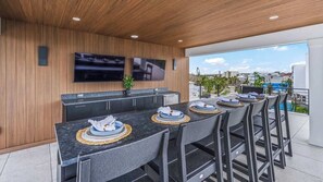Outdoor dining - #1 Rooftop Gulf Views-Theatre Room-Unmatched Slide (Sarasota)