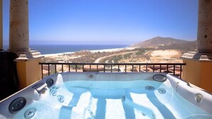 A hot tub with a view of the ocean and mountains. - 3BDOceanview Villa at MontecristoEstates (Cabo San Lucas)