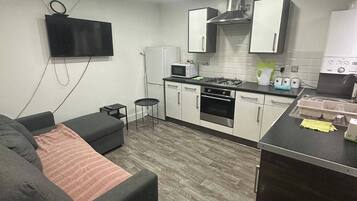 Apartamento | Área de estar | TV